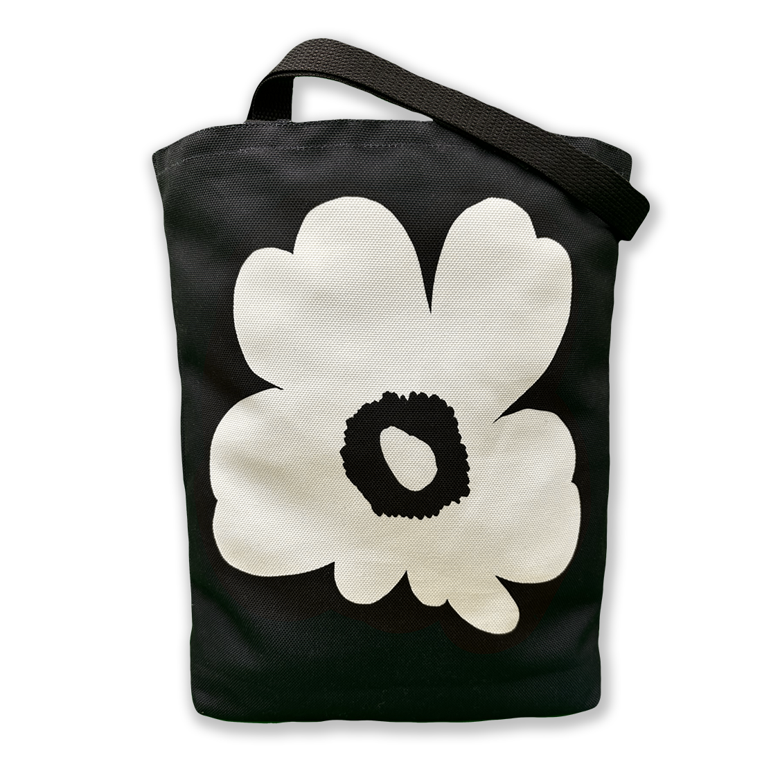 Black canvas tote bag with a bold white flower design, featuring a sturdy black strap for everyday use.